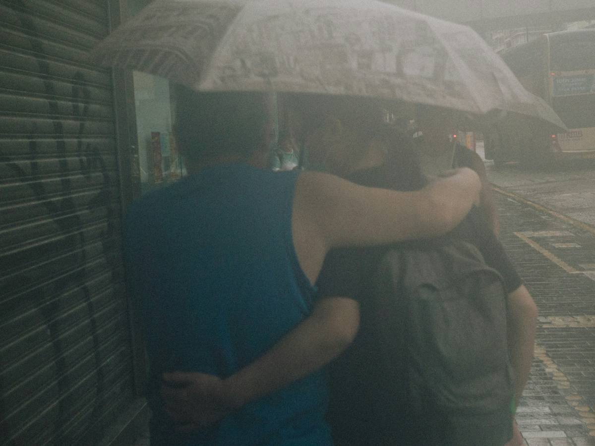 Luxury shower system dual head two people enjoying simultaneous rainfall and handheld spray